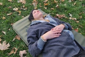 woman lying on a sleeping pad