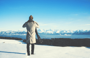 woman in scarf standing in snow
