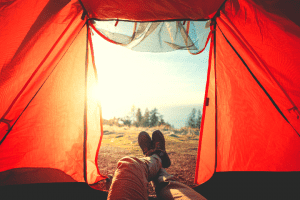 man lying in tent