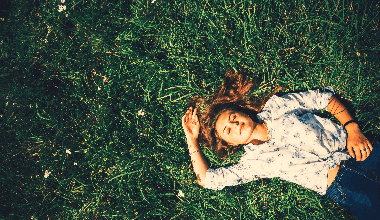 woman lying in the grass
