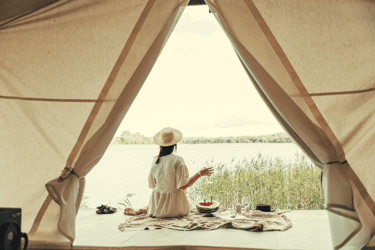 woman outside a yurt