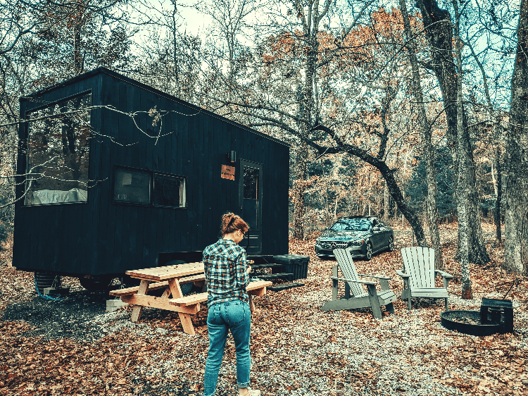 woman outside a cabin