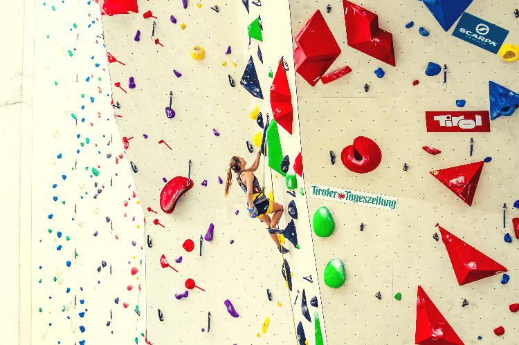 girl sport climbing in a gym