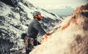 man rock climbing in the mountains