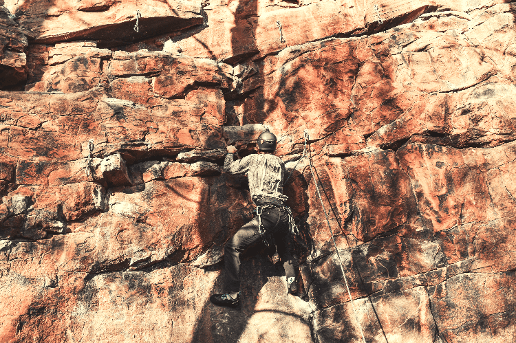 man rock climbing outdoors