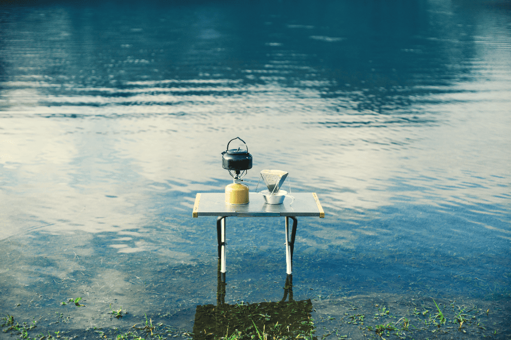 kettle and coffee on a table in a lake