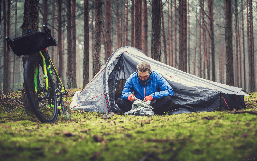 man sitting in his tent