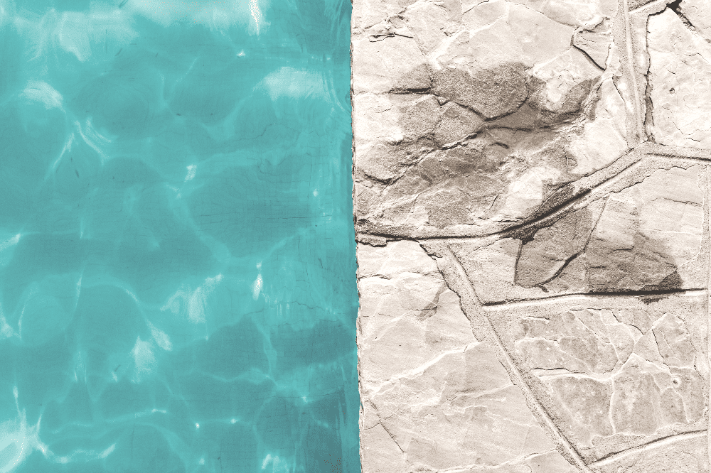 the edge of a pool of water