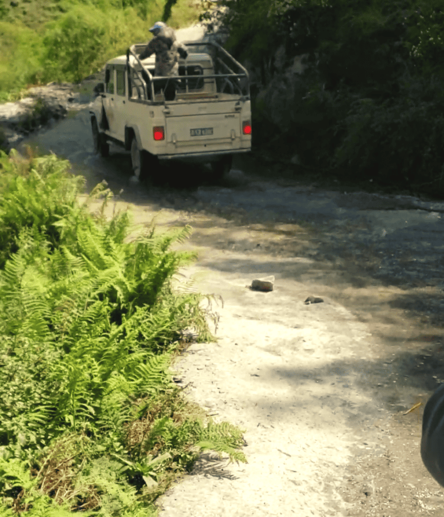 jeep driving down a dirt road in nepal