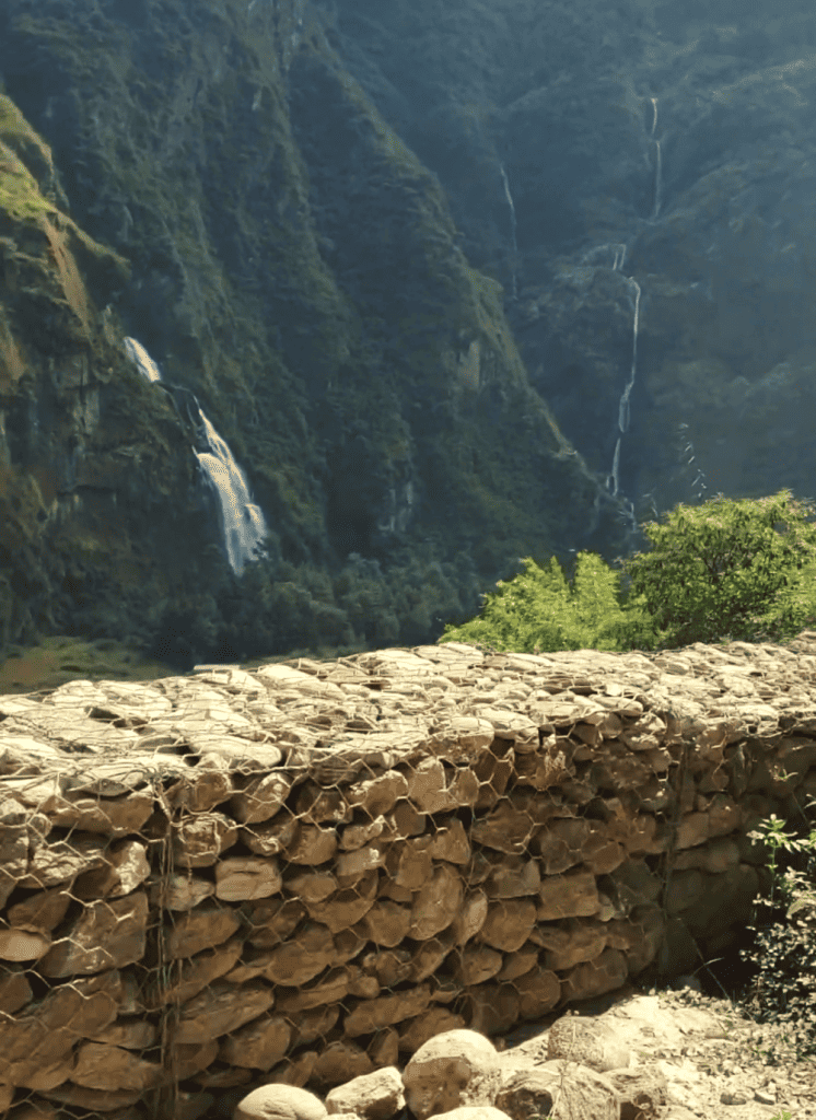 waterfall on a road in nepal