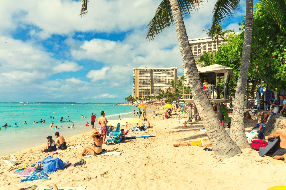 people laying on a beach in hawaii