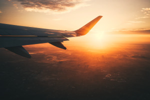 plane wing after takeoff at sunset in germany