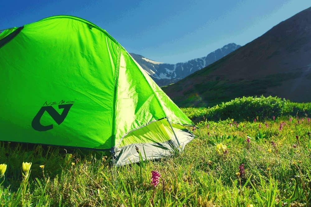 green nemo tent on a grassy plain