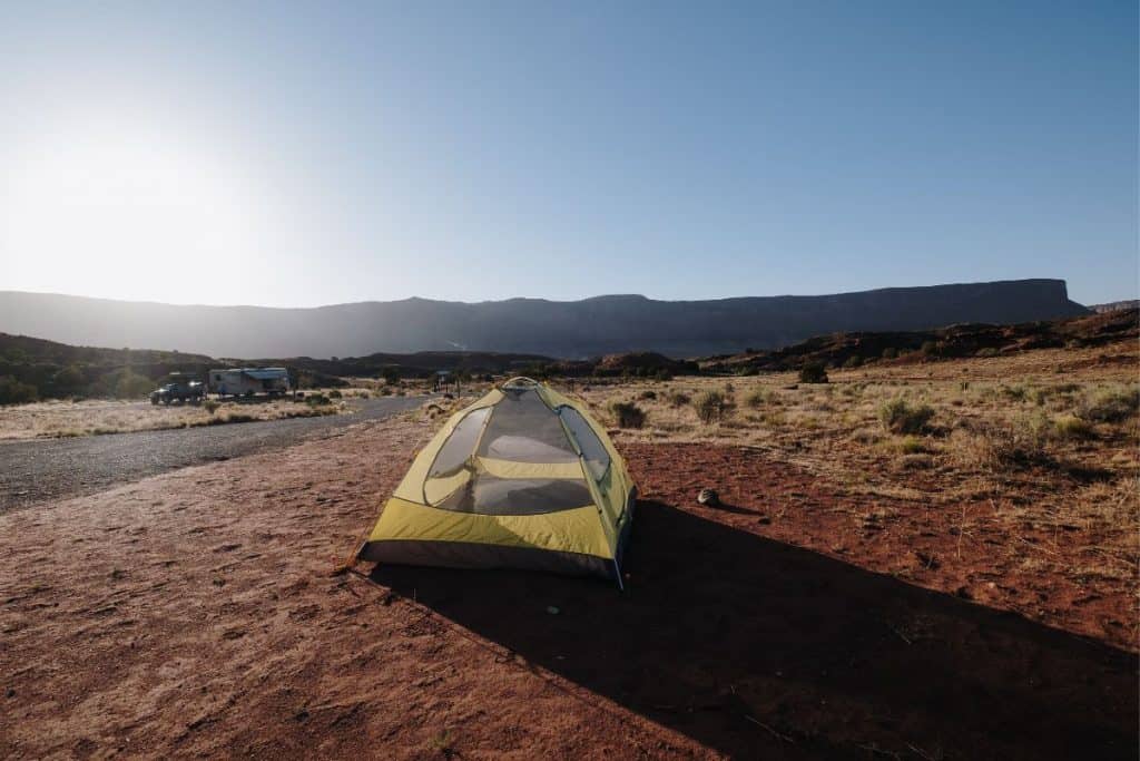 yellow tent on sandy ground