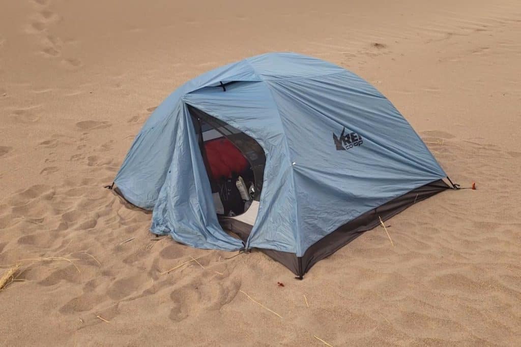 blue tent in sand