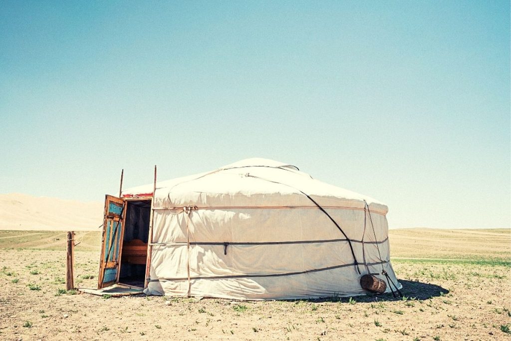 large canvas tent on an open plain