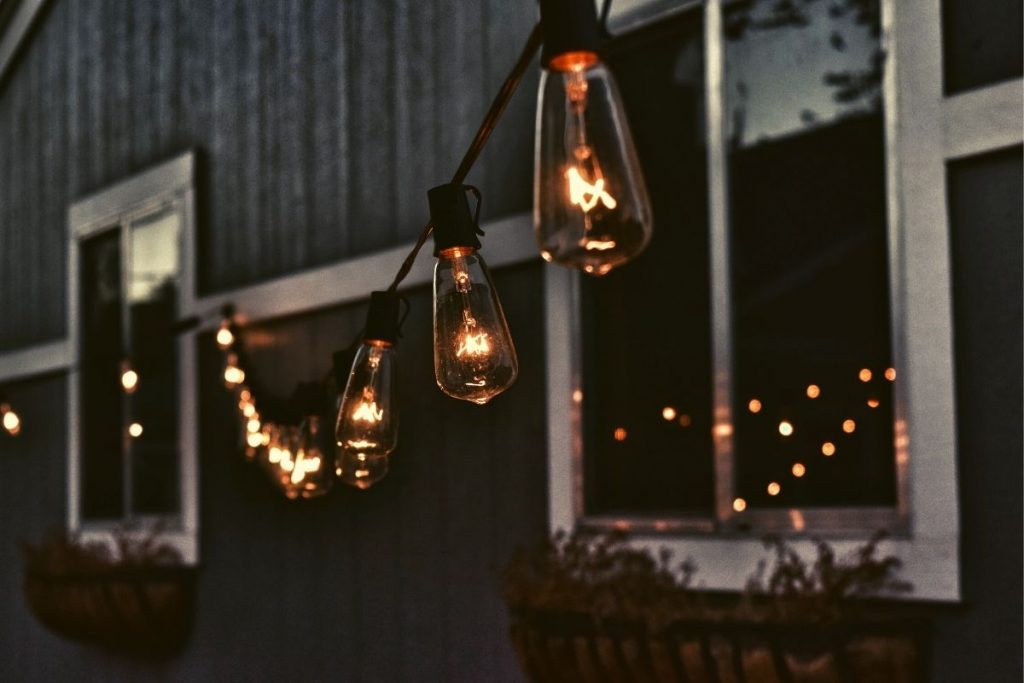 lightbulbs hanging outside of a house