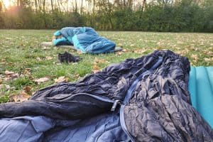 two sleeping bags on the grass camping