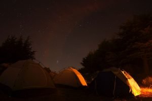 three tents at night