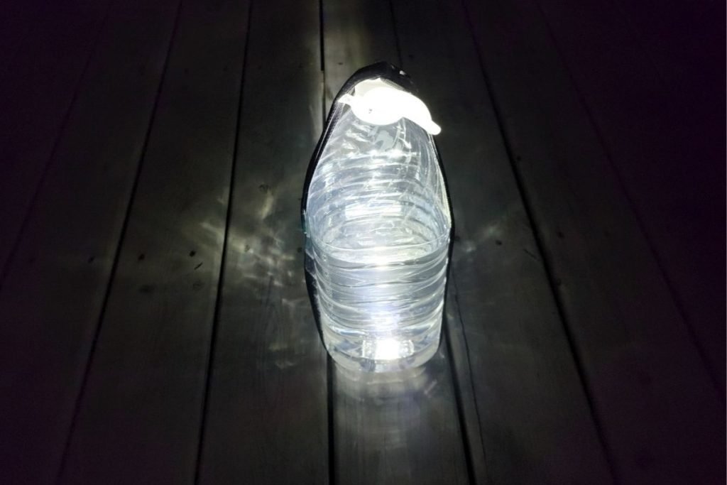 water jug with a headlamp at night