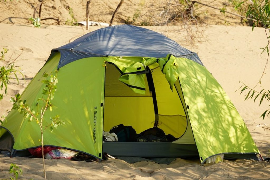 green tent sand desert