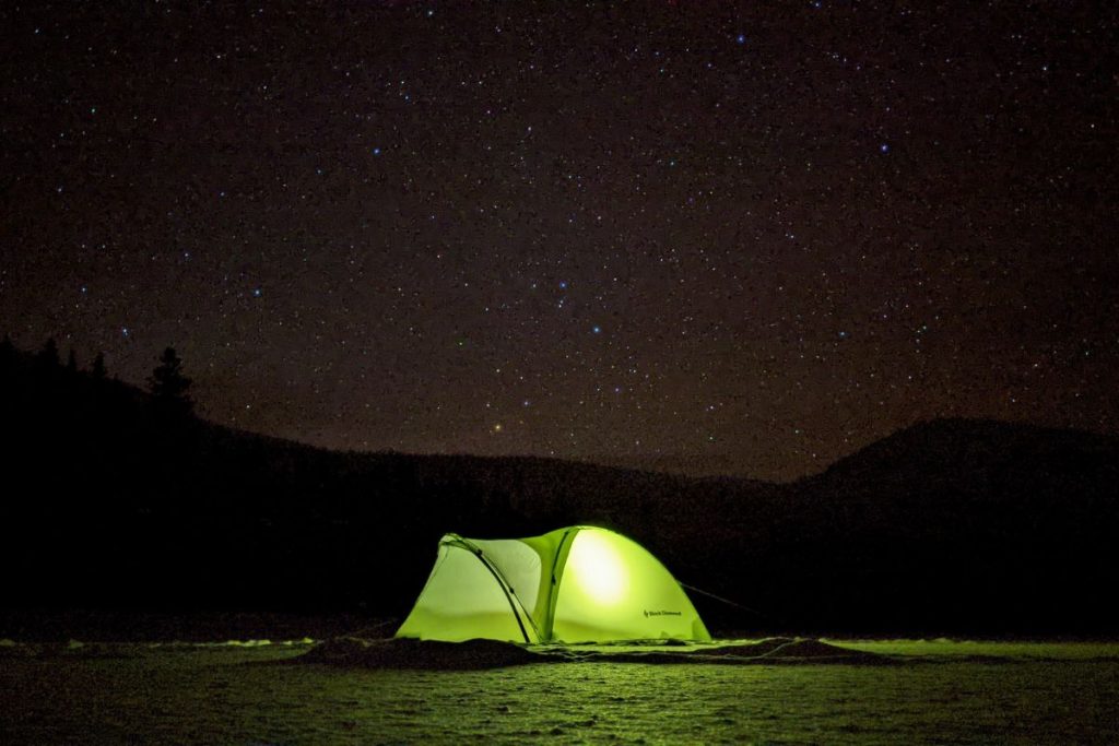 green tent dark night with light