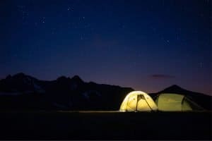two tents night sky stars light mountains