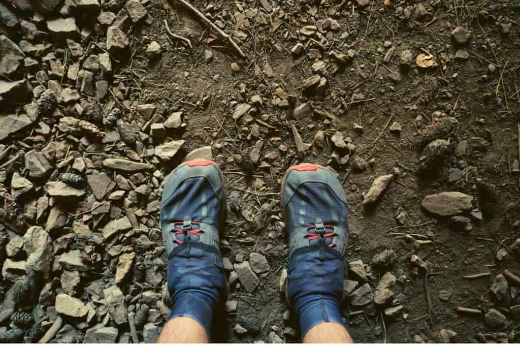 blue shoes on brown dirt