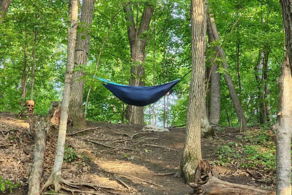 hammock hanging between trees on a hill