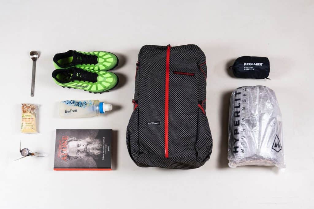 backpack, sleeping bag, book, green shoes, spoon, water bottle