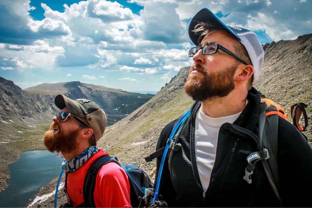 two men hiking in the mountains