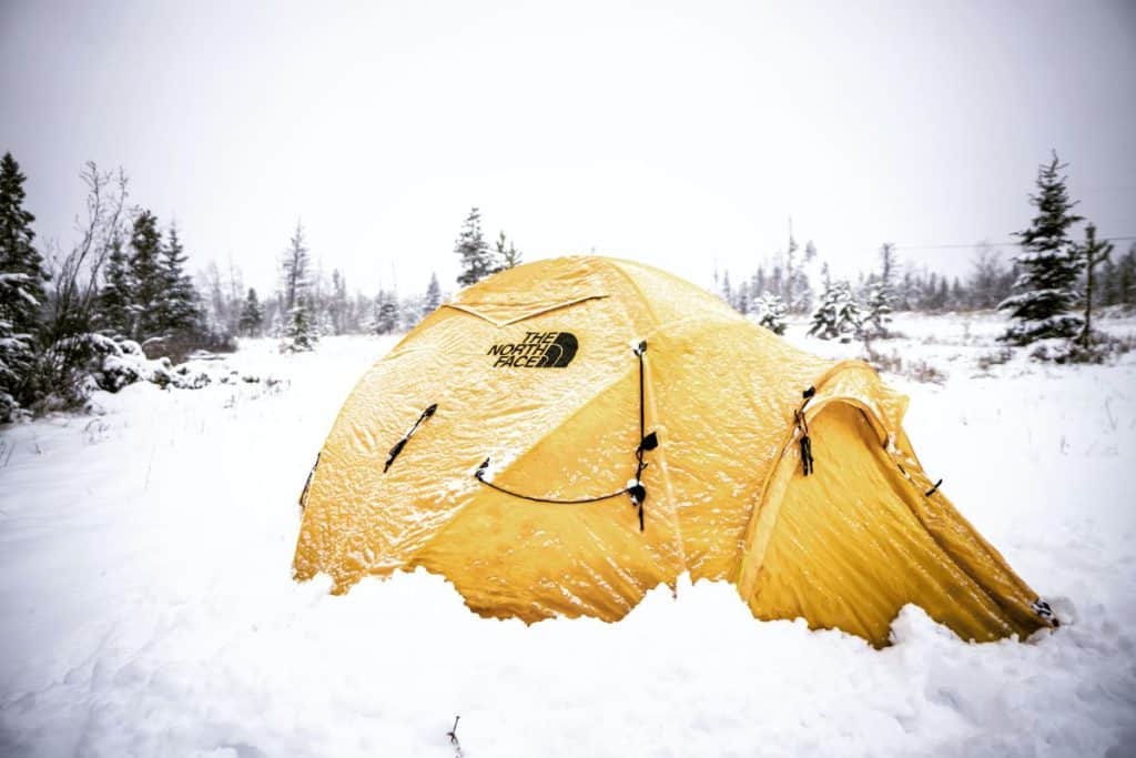 yellow tent in snow