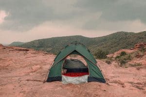 green tent on red rock