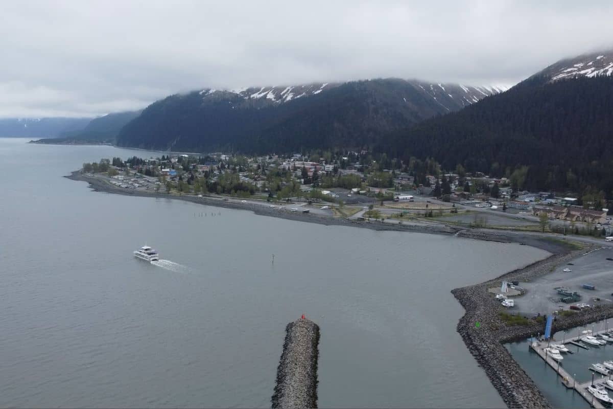 aerial view of seward alaska foggy mountains and ocean