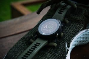 black watch on fabric on a wood table