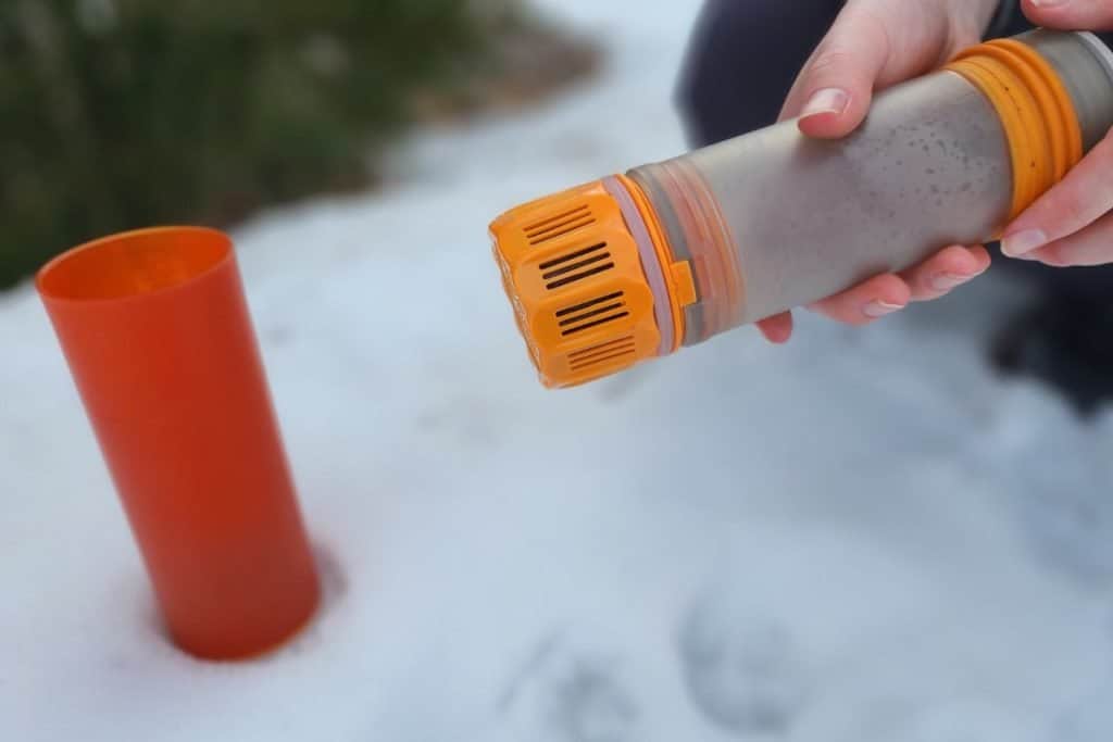 grayl water filter bottle in the snow