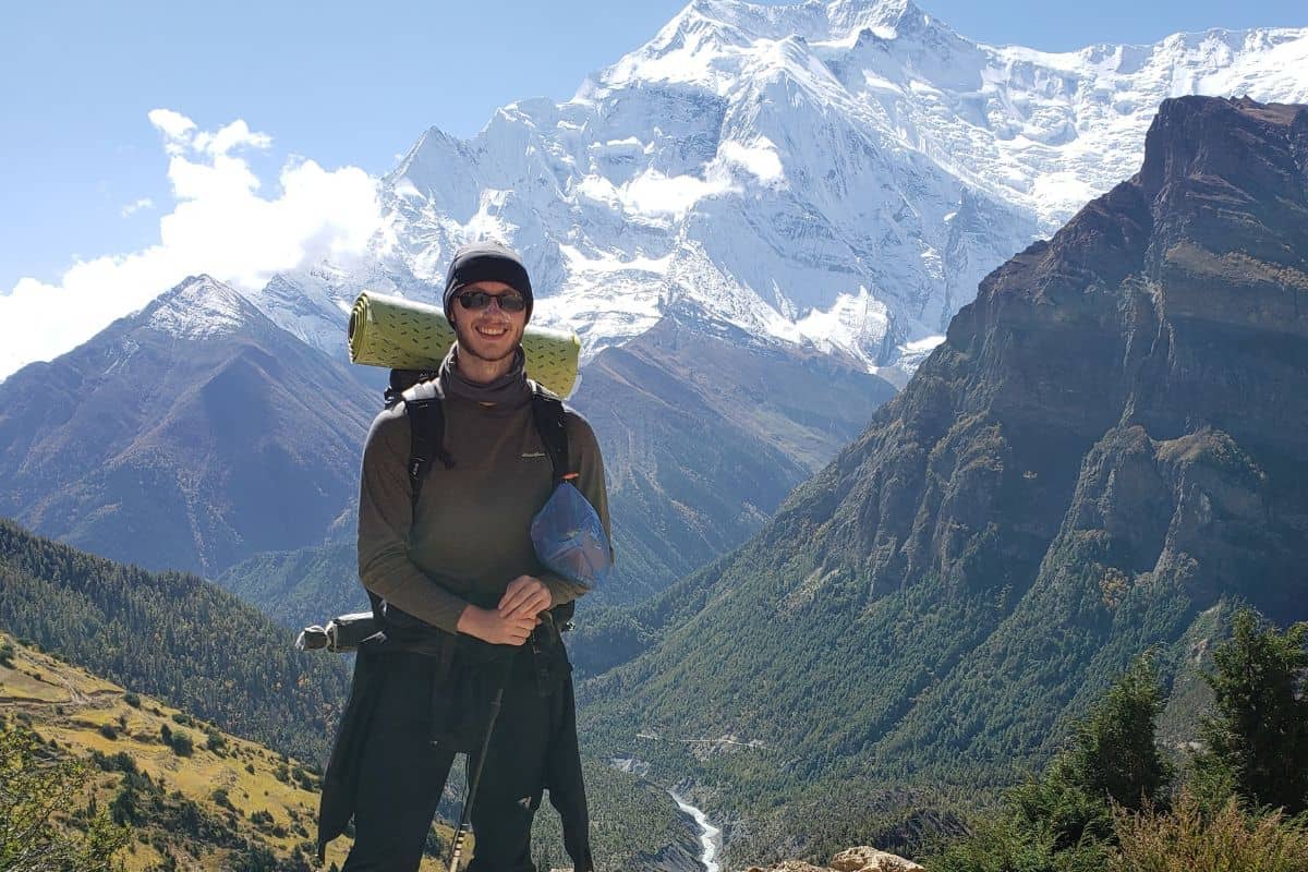 man standing in the mountains