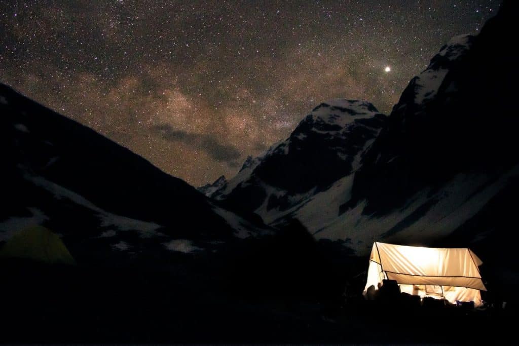 cabin tent in the mountains at dark