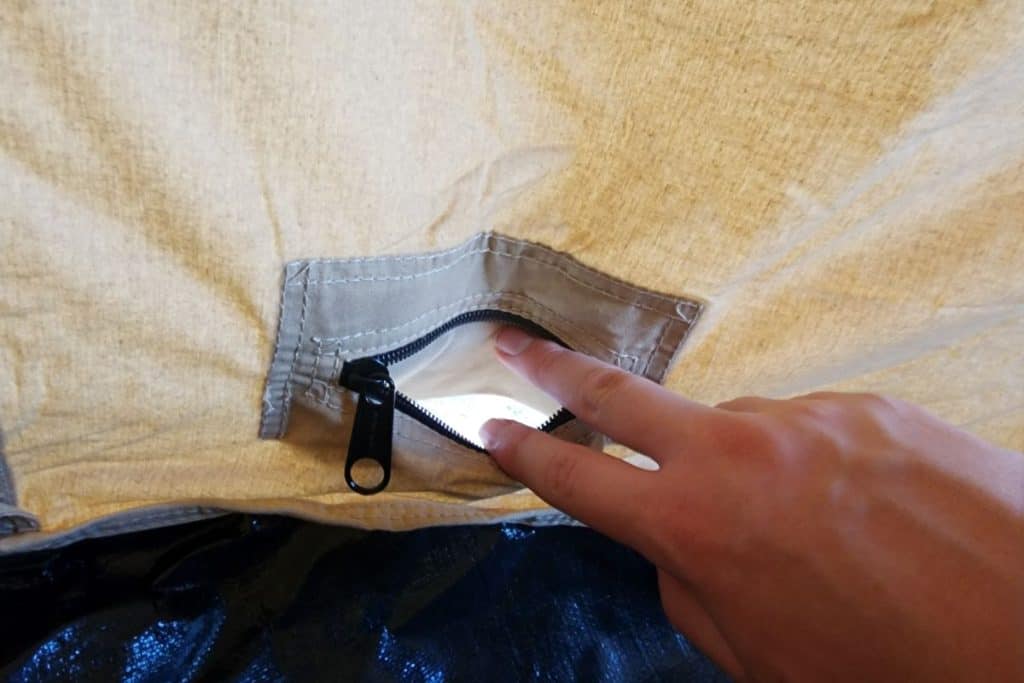 small opening in a canvas tent