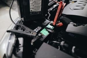 jumper cables on a car battery