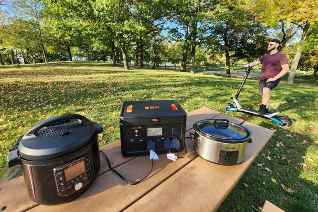 power station with instantpot, crockpot, and electric scooter at a picnic table