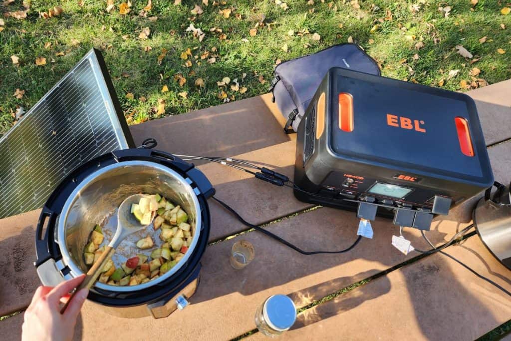 ebl power station powering an instantpot cooking apples on a picnic table