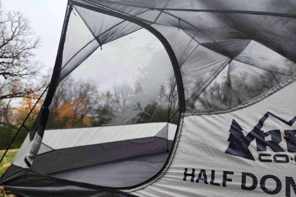 open mesh door of gray tent