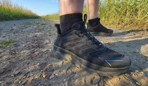 black sneakers on sand